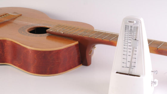 A metronome and guitar