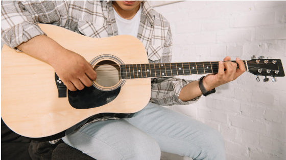 Man playing a guitar