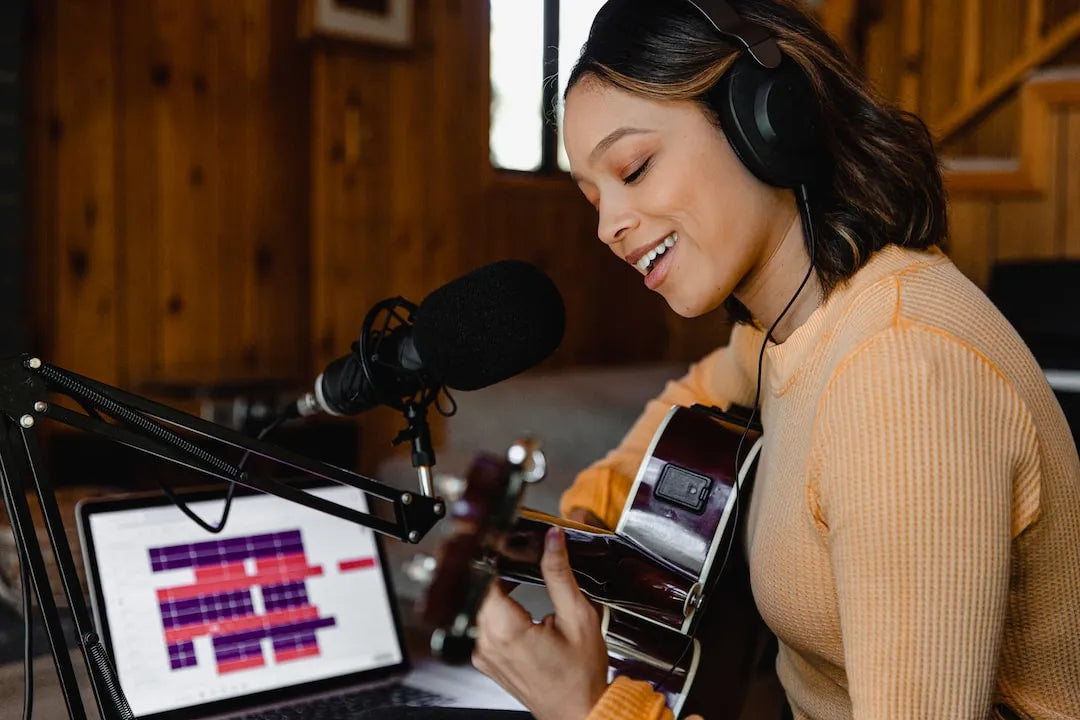 Woman getting online guitar lessons