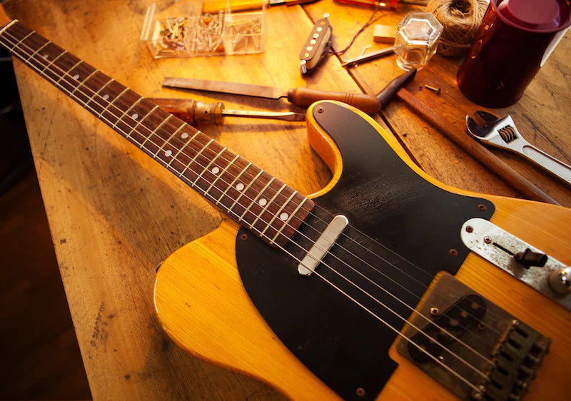 Guitar on repair bench