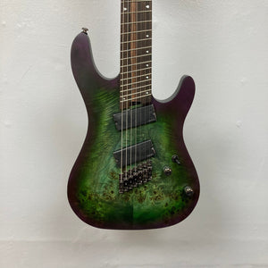 Cort KX507 SDG 7-String Multi-Scale electric guitar with Macassar Ebony fretboard, individual hardtail bridge, and Fishman Fluence Modern Humbucker pickups.