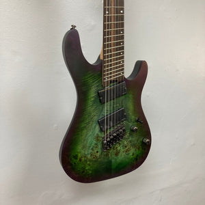 Cort KX507 SDG 7-String Multi-Scale electric guitar with Fishman Fluence pickups and individual hardtail bridge, featuring a Poplar Burl top on Mahogany body.