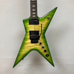 Dean Stealth Floyd FM Dime Slime electric guitar with black and yellow accents, ebony fretboard, and 22 jumbo frets, displayed on a wall. Comes with a case.