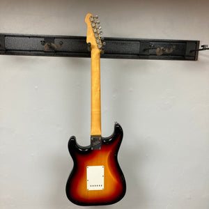 ESP Japan 400 Series Strat-style guitar mounted on a wall, showcasing its neck and body design, available with a case.