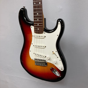 ESP Japan 400 Series Strat-style guitar on display, featuring a close-up of strings and white knobs, includes a case.