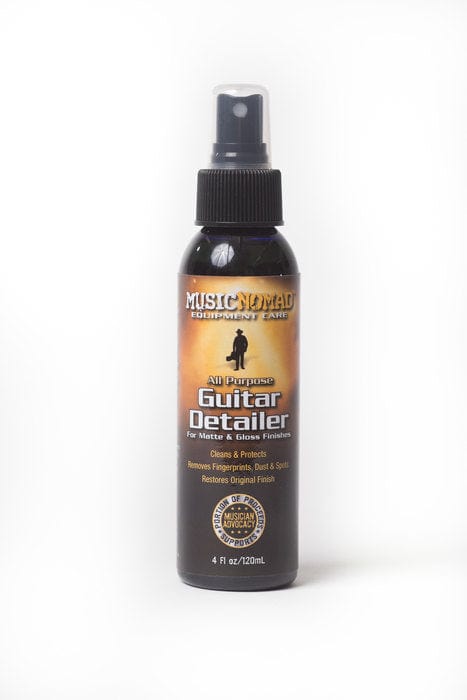 Bottle of Music Nomad Guitar Detailer with label showing a person, part of the Total Guitar Spa Kit.