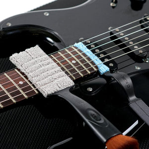 Close-up of the Music Nomad Total Guitar Spa Kit, showcasing various specialized guitar care products and tools for comprehensive maintenance and cleaning.