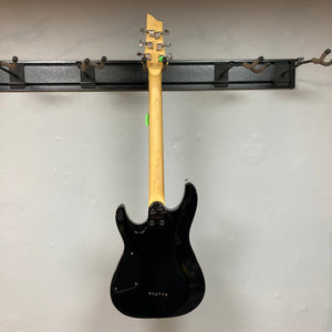 Schecter C6 Plus Charcoal Burst Used electric guitar with a comfortable basswood body and bolt-on maple neck, hanging on a wall.