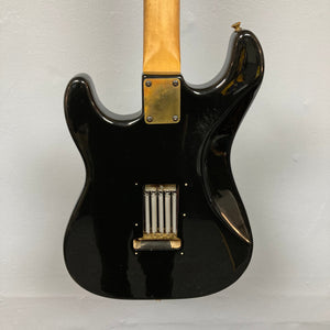 Schecter USA Super Strat guitar, black body, gold neck, close-up details of coil and hardware, from Guitars on Main.