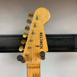 Schecter USA Super Strat, 1983-1987 model, showcasing detailed close-up of its strings and body, featured at Guitars on Main.