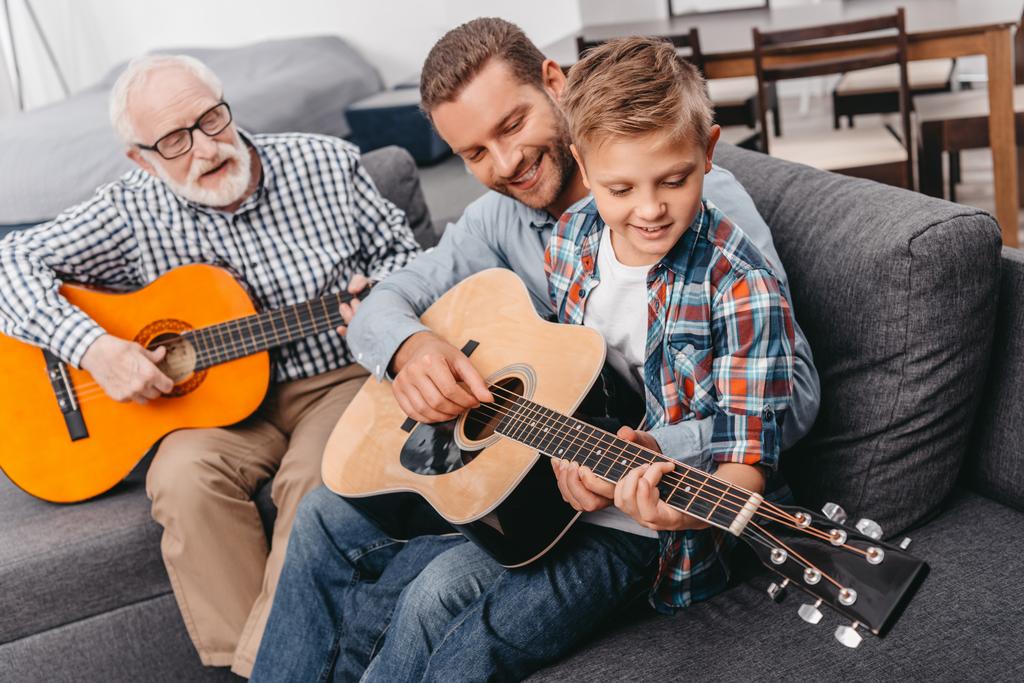 Family playing guitar