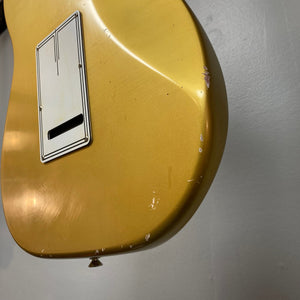 Close-up of the TopHat Stratavarius Aztec Gold Relic guitar, featuring a lacquered neck, aged Aztec Gold finish, and Callaham tremolo.