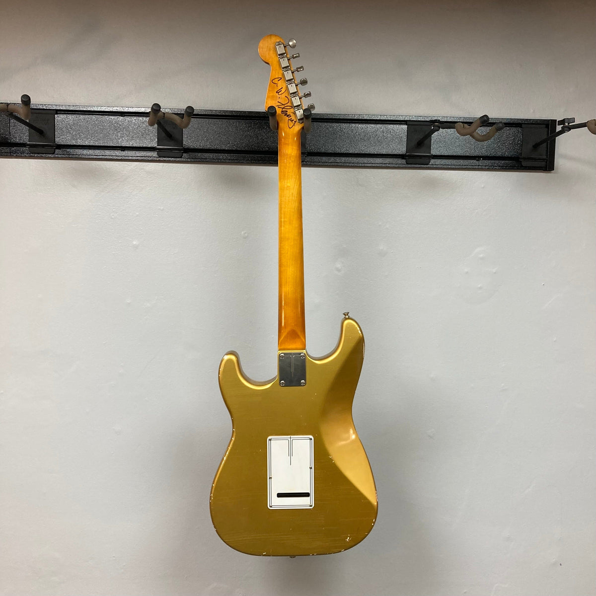 TopHat Stratavarius Aztec Gold Relic electric guitar on display, showcasing its aged finish, rosewood fretboard, and nickel hardware.