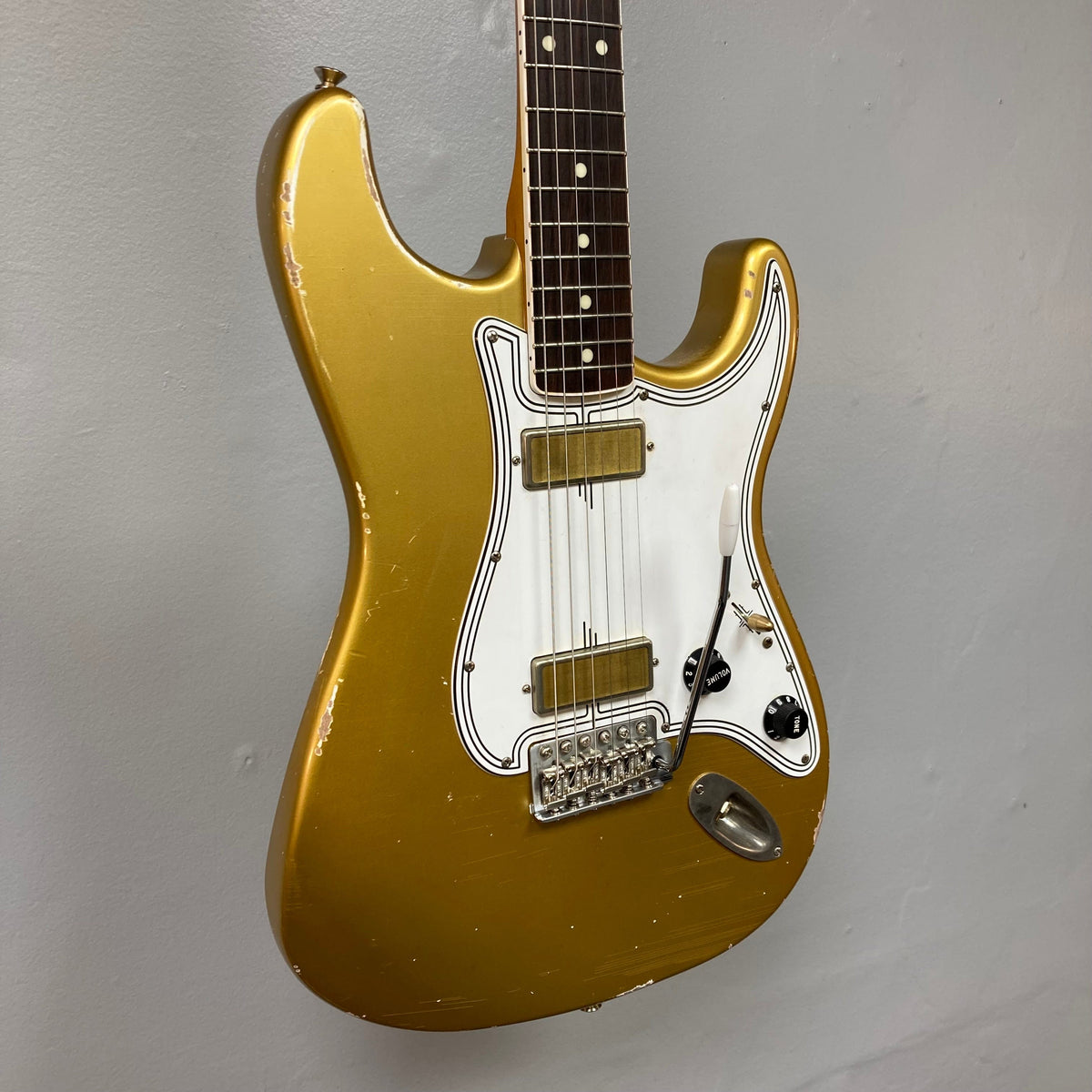 TopHat Stratavarius Aztec Gold Relic electric guitar with aged finish, white body, and nickel hardware, featuring a rosewood fretboard and Callaham tremolo bridge.