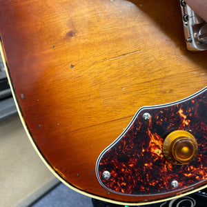 TopHat Telavarius Junior Relic Sunburst guitar close-up, showcasing bridge with a single dogear P90 pickup and double-bound mahogany body.