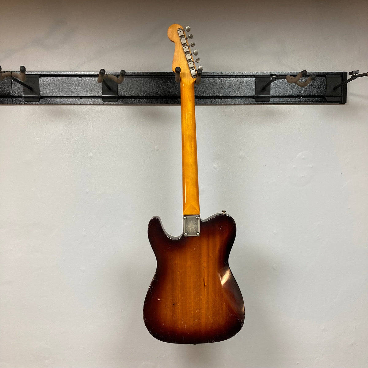 TopHat Telavarius Junior Relic Sunburst electric guitar with a single dogear P90 pickup, Faber wraparound bridge, and double-bound African ribbon mahogany body.