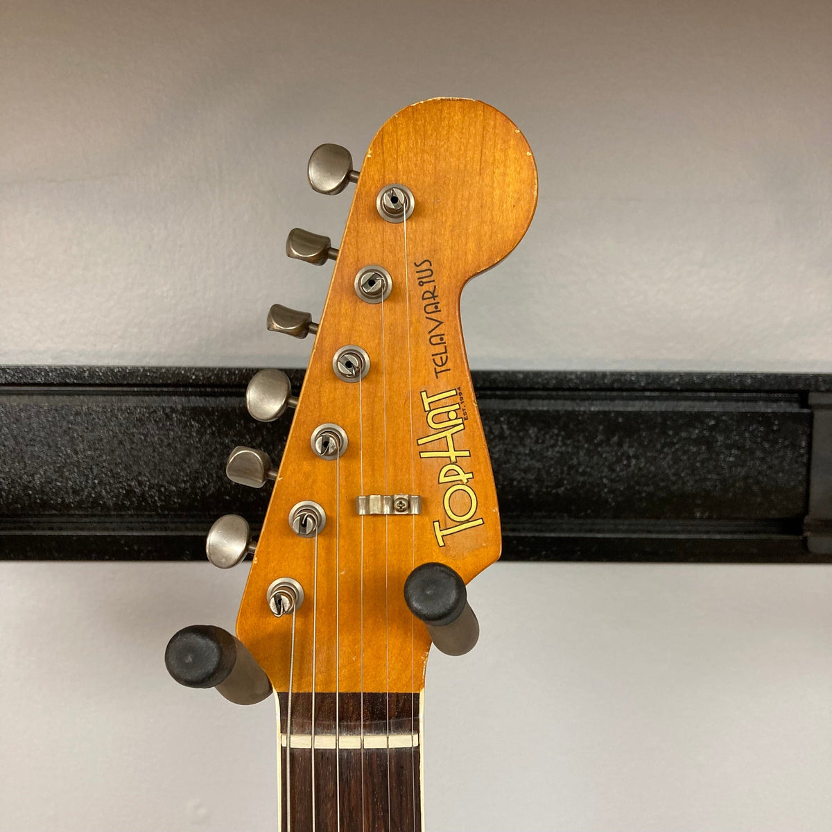 TopHat Telavarius Junior Relic Sunburst guitar close-up showing neck, rosewood fingerboard, and bridge with single P90 pickup.