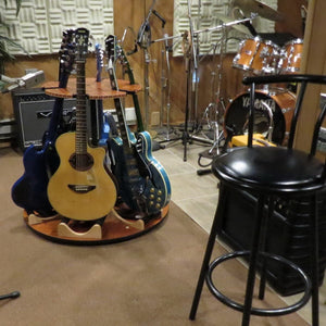 Carousel Deluxe Multi-Guitar Stand showcasing six guitars on a round table, designed for efficient storage and easy 360° access.