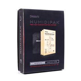 D&#39;Addario Humidipak Two-Way Humidification System box, featuring an image of books and a diagram, for maintaining guitar humidity without manual adjustments.