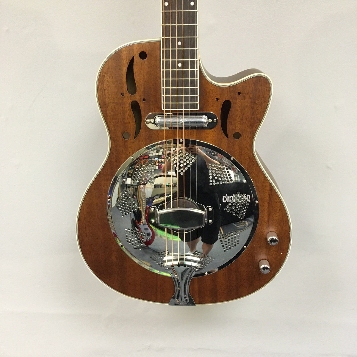 Dean CE Acoustic-Electric Resonator Guitar with eastern mahogany body, purple heart fingerboard, and silver mirror resonator, featuring a modern design and electronics.