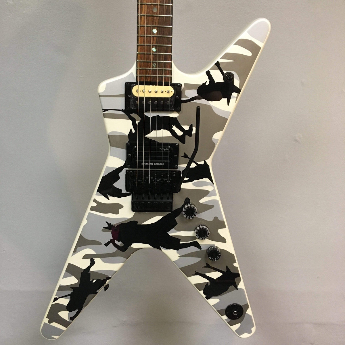 Dean Dime O Flage ML Electric Guitar with camouflage design, featuring a unique graphic finish, strings, and pickups.