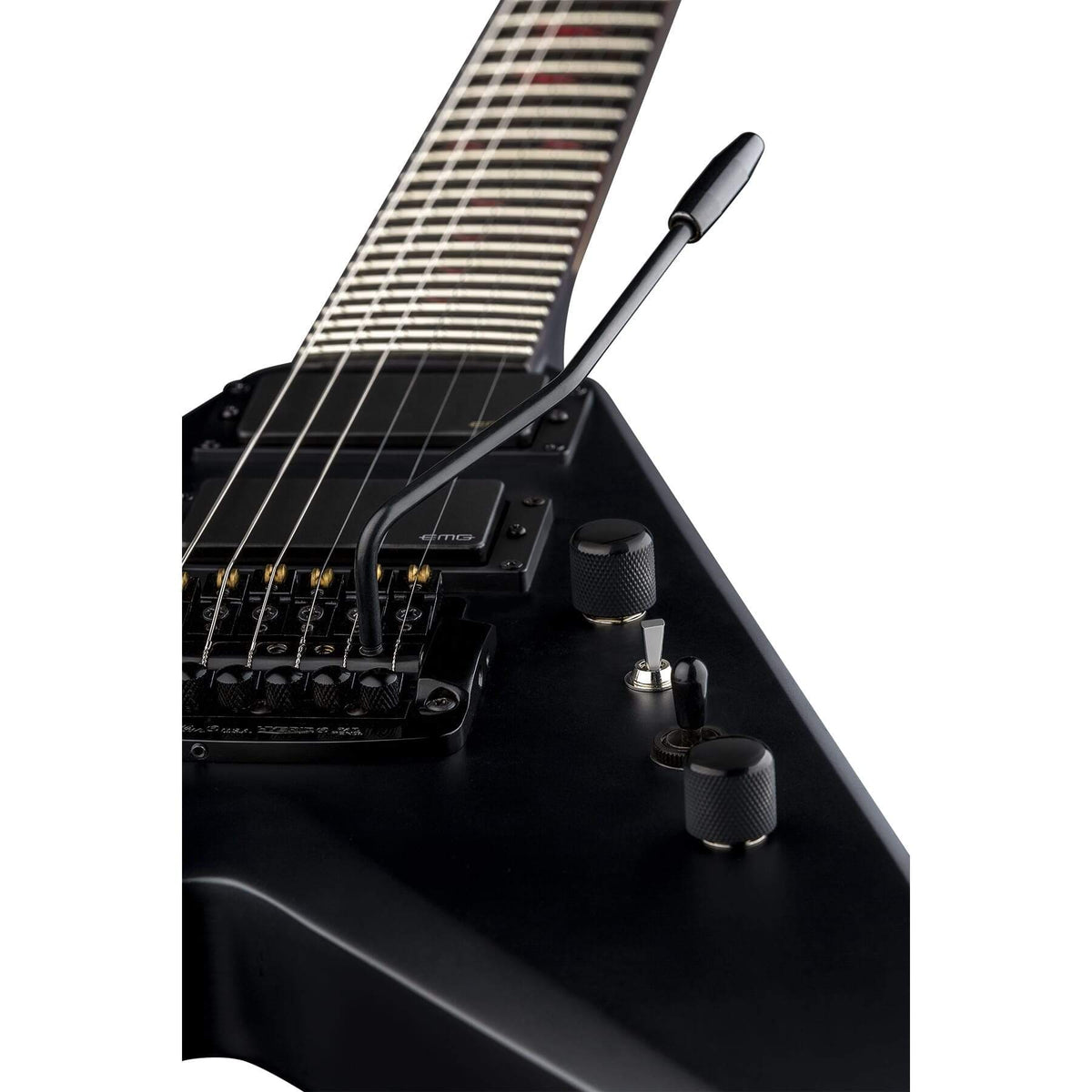 Dean Kerry King V Signature Guitar, close-up of black knob and guitar strings, featuring EMG pickups and Kahler Hybrid tremolo system.