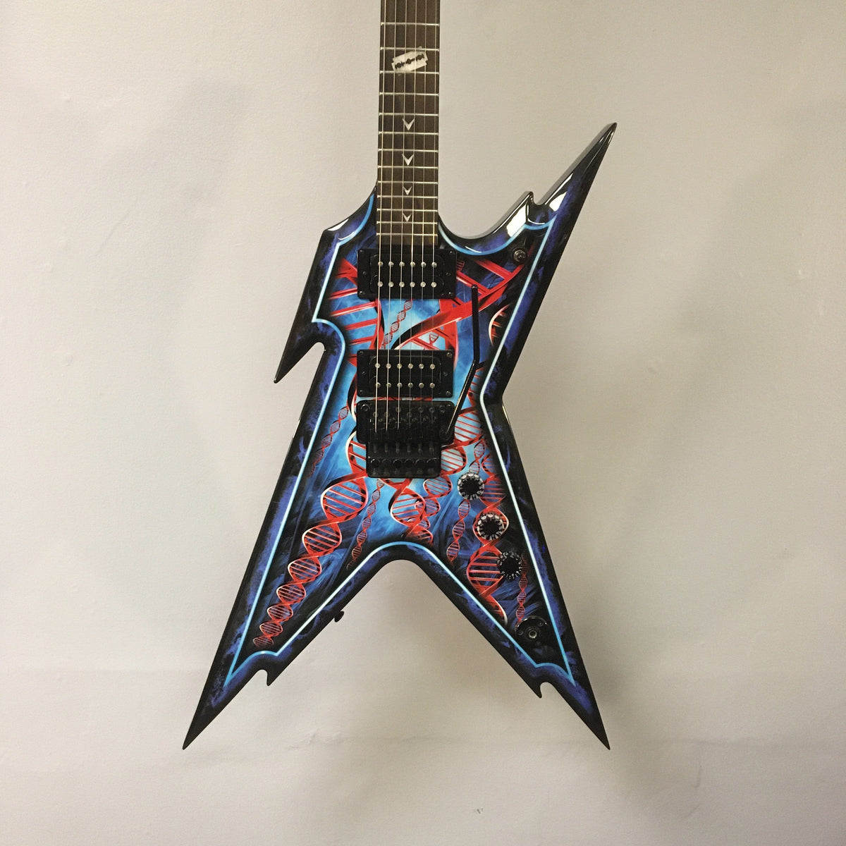 Dean Guitars Razorback Dimebag Floyd DNA Spatter electric guitar, used, with a distinct design and included case.