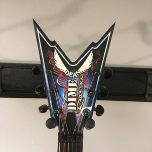 Dean Guitars Razorback Dimebag Floyd DNA Spatter Electric Guitar, used, wall-mounted, featuring Grover tuners, Floyd Rose bridge, and DMT humbucker pickups.