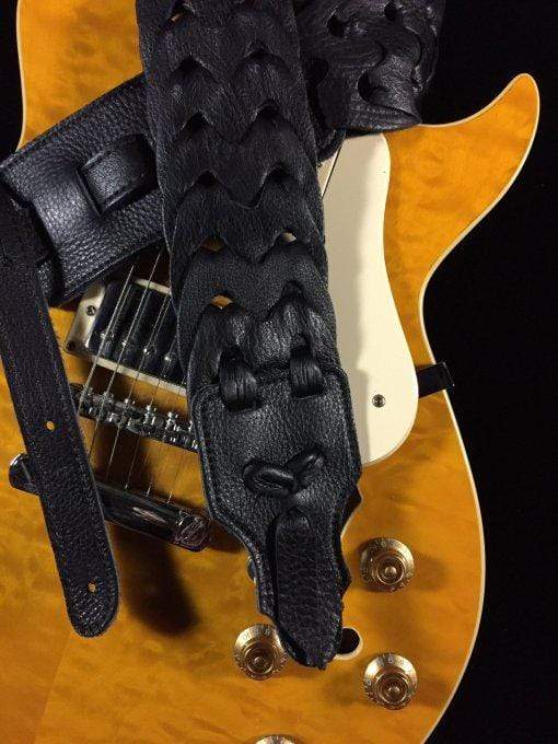 Franklin Link Glove Leather Handmade Guitar Strap attached to a guitar, showcasing its unique four-layer leather construction and smooth, double-ply glove leather end tab.