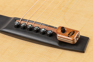 KNA SG-2 Portable Piezo Pickup for Steel String Guitar, close-up of guitar bridge with volume control.