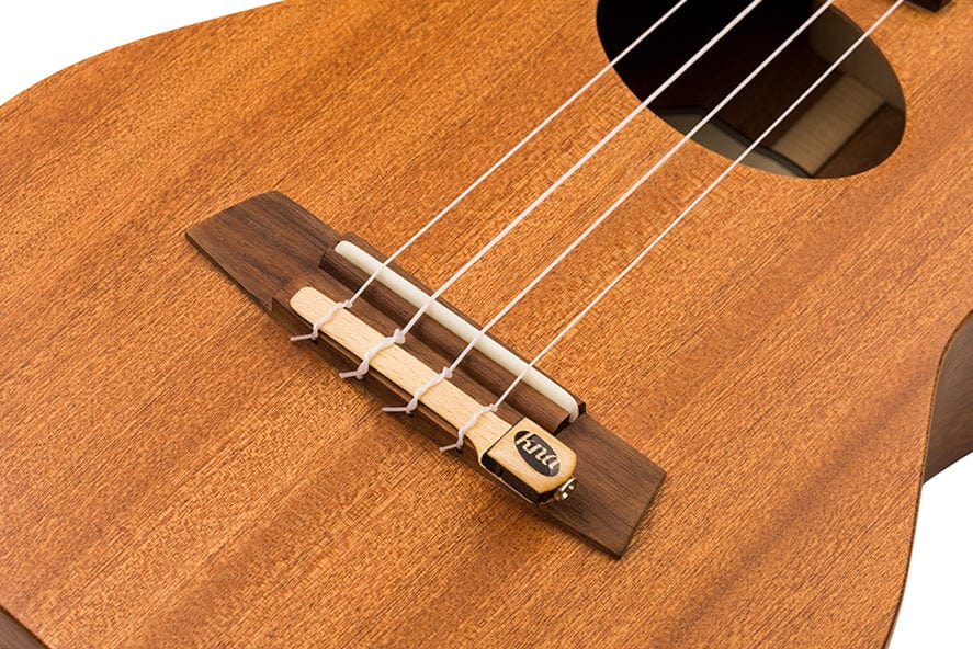 KNA UK-1 Detachable Piezo Ukulele Pickup attached to a ukulele tie block, showcasing its easy installation and suitability for various ukulele sizes.