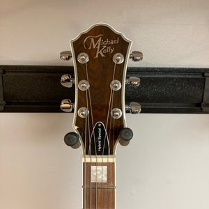 Michael Kelly Hybrid Special Ziricote guitar, close-up showing strings, pegs, and detailed craftsmanship.