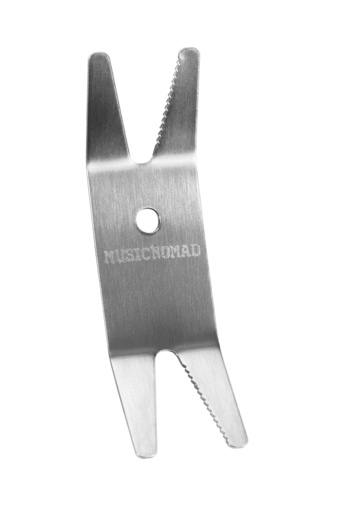 Music Nomad Premium Spanner Wrench with Microfiber Suede Backing, ideal for tightening guitar gear with precision. Compact stainless steel tool featuring a central hole and soft backing.