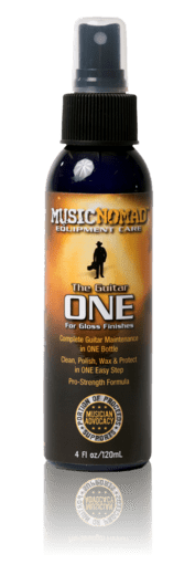 Music Nomad The Guitar ONE - All in One Cleaner, Polish, Wax 4oz spray bottle with label detailing cleaning and polishing properties.