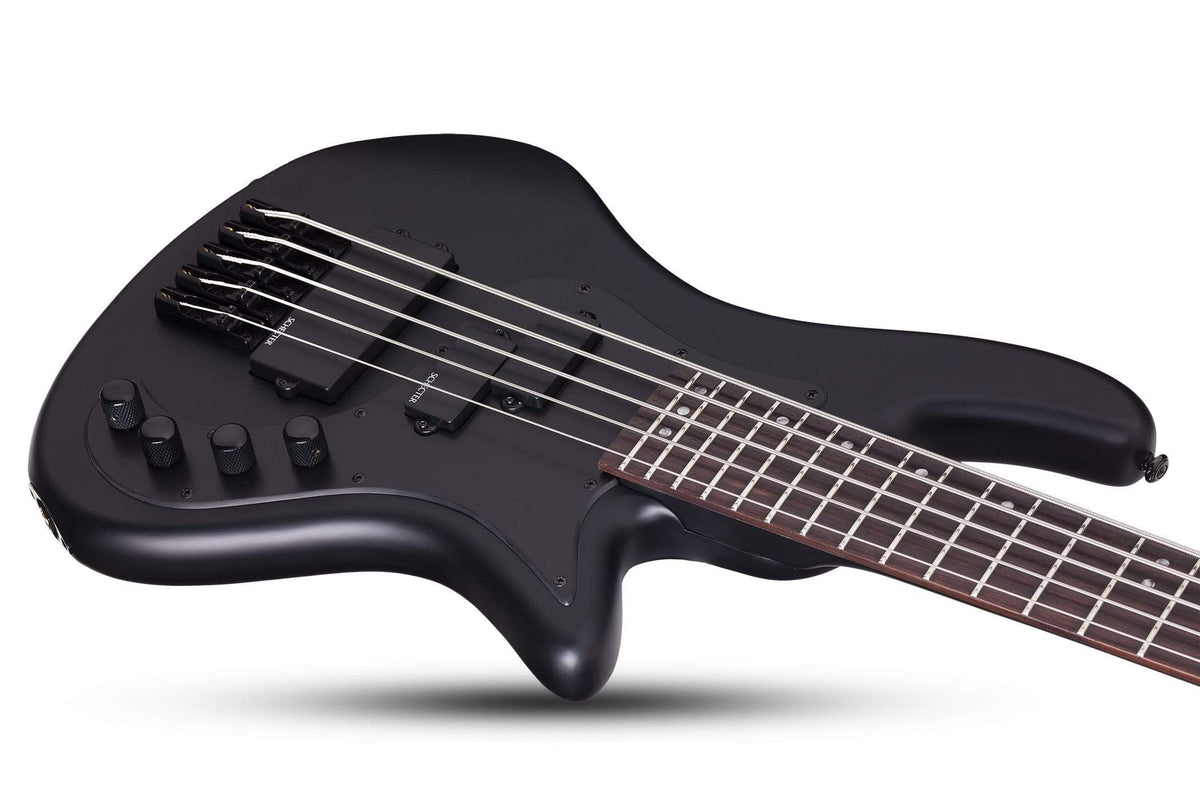 Schecter Stiletto Stealth-5 electric guitar with black body, rosewood fretboard, and grey pearloid inlays.