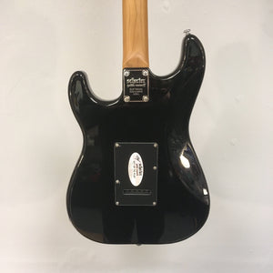 Schecter Nick Johnston Traditional Atomic Ink electric guitar with roasted maple neck, chrome hardware, and Diamond Vintage Tremolo bridge, showcased in an open box.