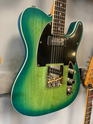 Schecter PT Special Aqua Burst Pearl (AQBP) electric guitar with green and black finish, visible strings, and cream binding.