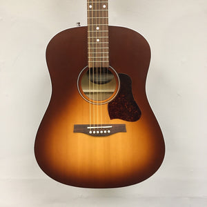 Seagull Entourage Autumn Burst Acoustic Guitar featuring a dreadnought body, white binding, and upgraded pickguard, showcased in a close-up view highlighting strings and pegs.